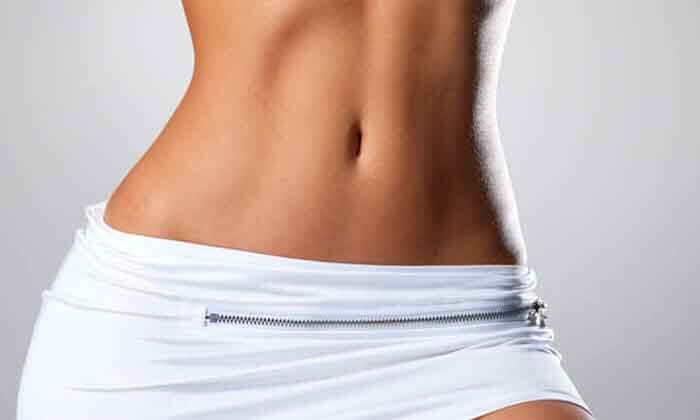 Close-up picture of a woman happy with her new shape in abdomen, hips and legas
